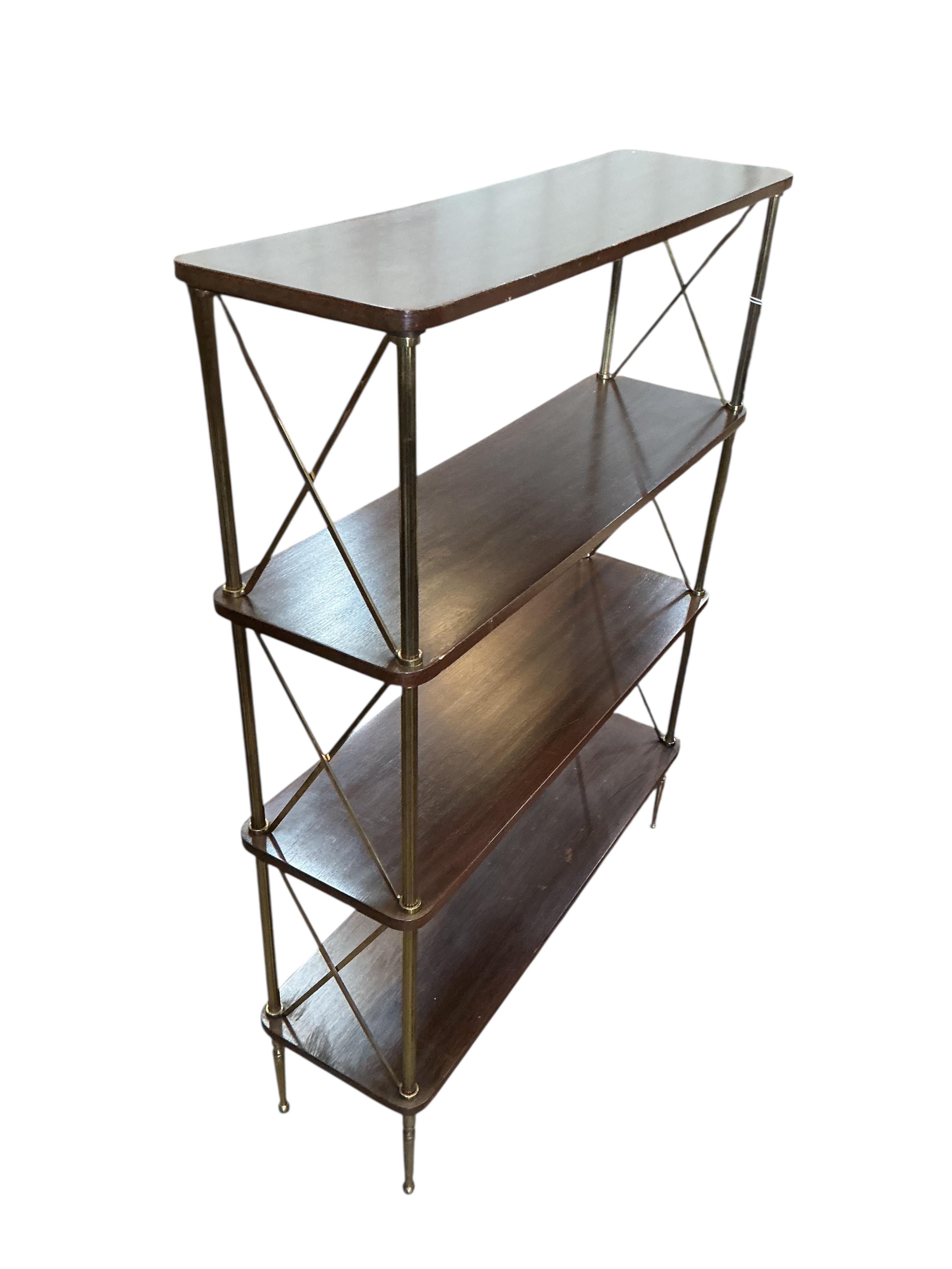 A Maison Jansen style mahogany and brass four tier open bookcase, width 75cm, depth 23cm, height 99cm